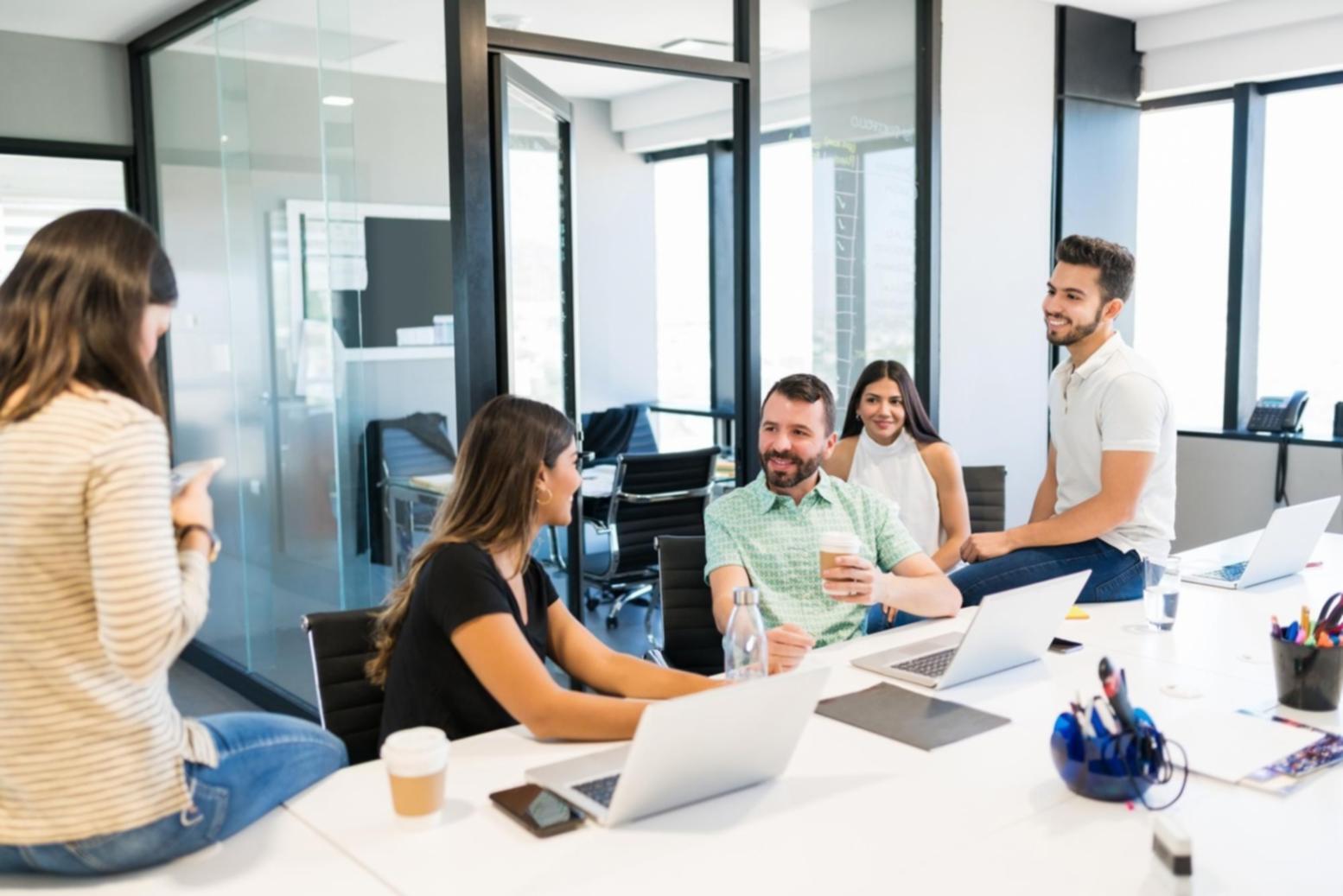 Students collaborating on business negotiation frameworks in study environment